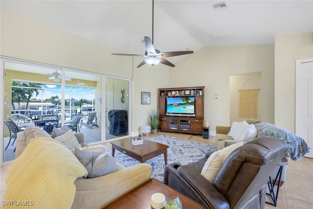 tiled living room featuring lofted ceiling and ceiling fan