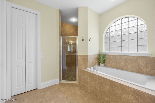 bathroom featuring tile patterned flooring and independent shower and bath