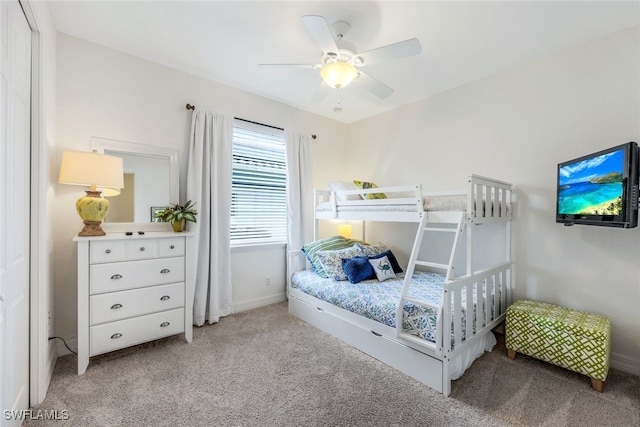 bedroom featuring light carpet and ceiling fan