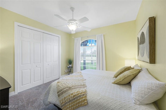 carpeted bedroom featuring ceiling fan and a closet