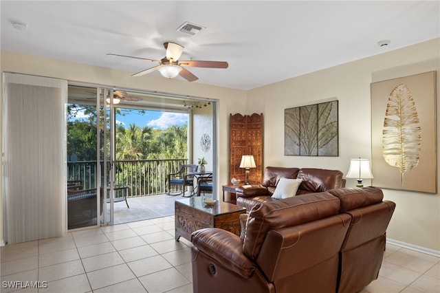 living room featuring ceiling fan and light tile patterned flooring