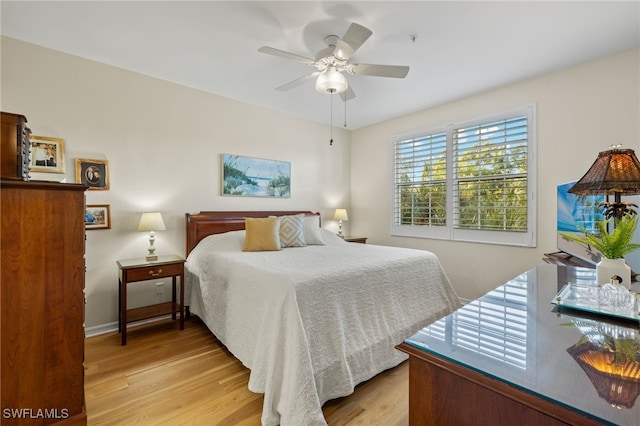 bedroom featuring ceiling fan and light hardwood / wood-style flooring