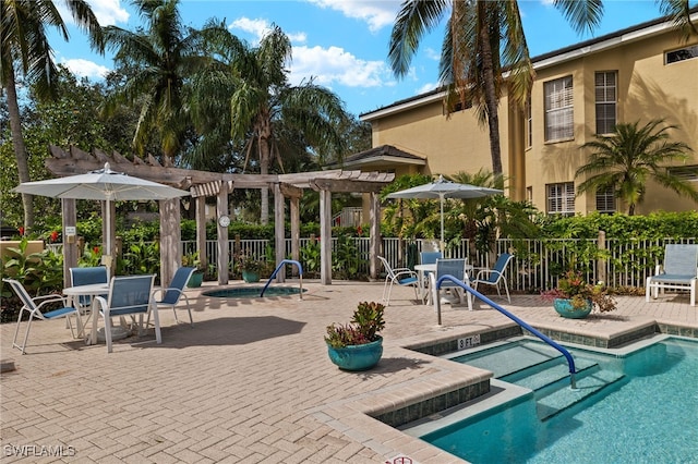 view of pool featuring a pergola, a patio area, and a community hot tub