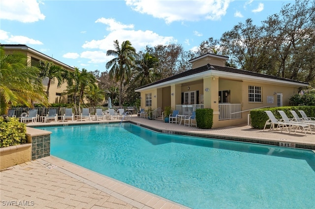 view of swimming pool with a patio