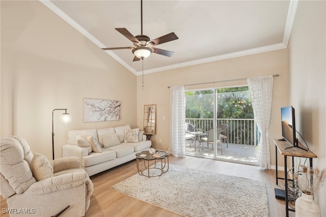 living room with ceiling fan, light wood-type flooring, ornamental molding, and lofted ceiling