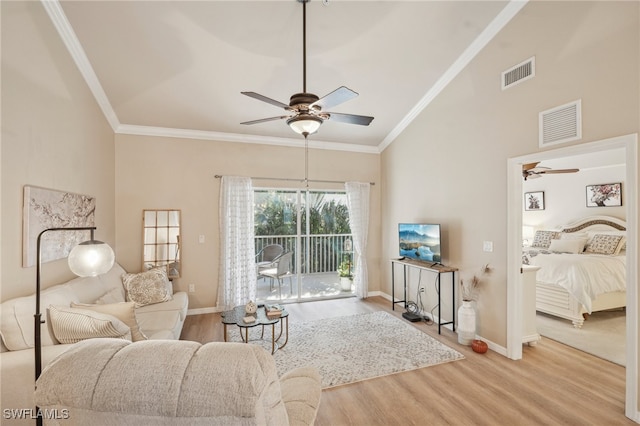 living room featuring wood-type flooring, crown molding, and ceiling fan