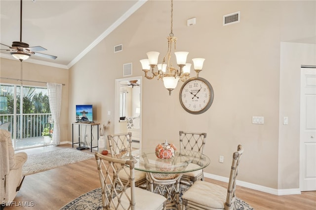 dining room featuring high vaulted ceiling, light hardwood / wood-style floors, ceiling fan, and crown molding