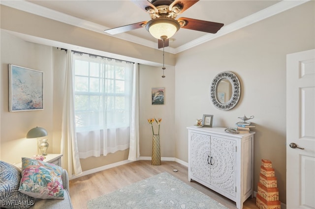 bedroom featuring ceiling fan, light hardwood / wood-style flooring, and ornamental molding