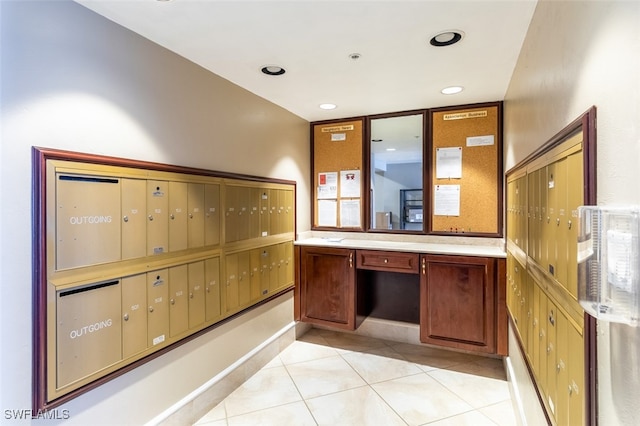 kitchen with a mail area and light tile patterned floors