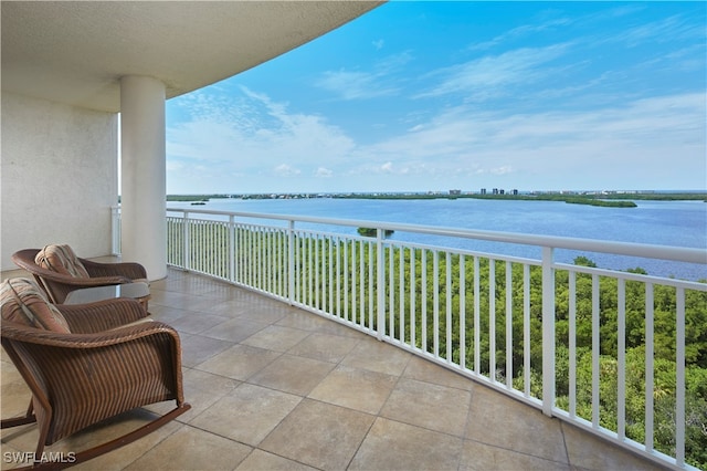 balcony featuring a water view