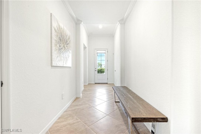 entryway featuring crown molding, baseboards, and light tile patterned floors