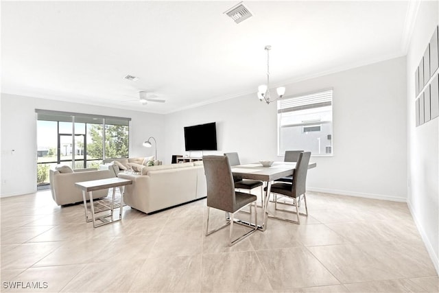 dining space featuring visible vents, crown molding, baseboards, and ceiling fan with notable chandelier