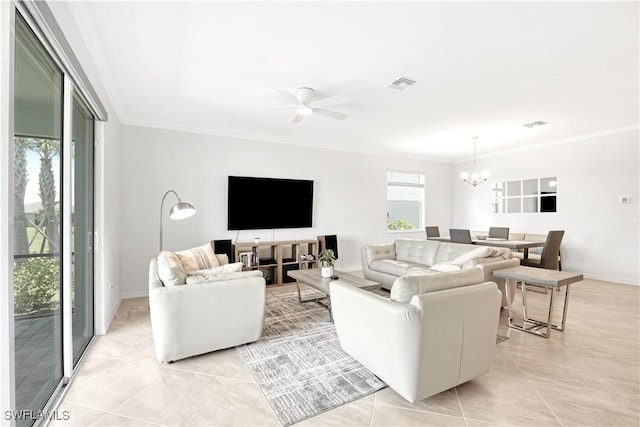 living area with light tile patterned floors, ornamental molding, visible vents, and baseboards