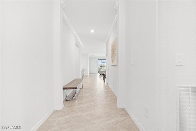 corridor with baseboards, visible vents, crown molding, and recessed lighting