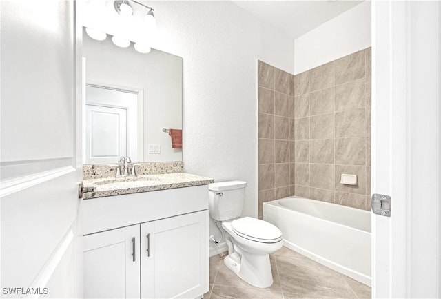 bathroom featuring shower / bath combination, tile patterned flooring, vanity, and toilet