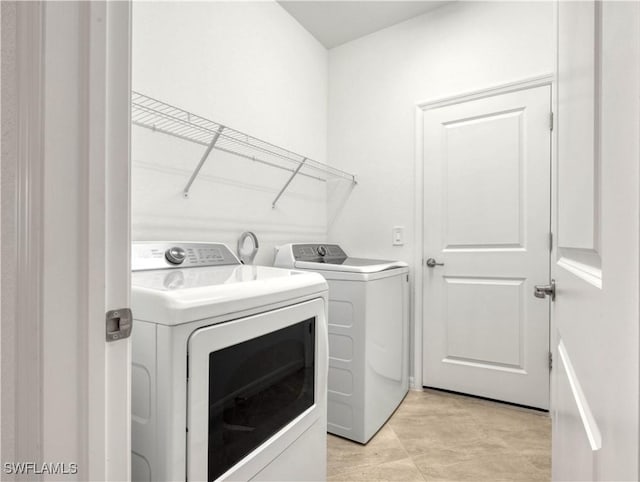 laundry area featuring laundry area and independent washer and dryer