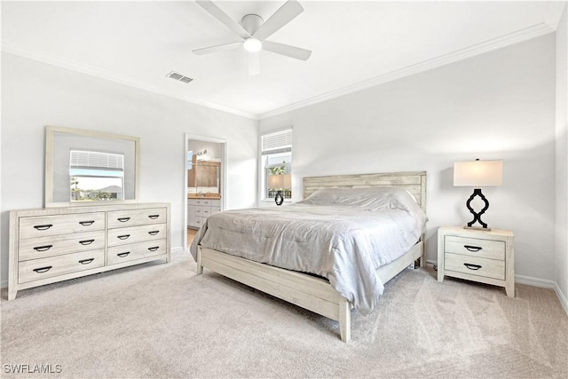 carpeted bedroom featuring ceiling fan, connected bathroom, visible vents, baseboards, and crown molding