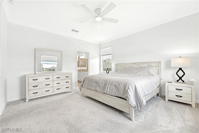 bedroom with connected bathroom, carpet, visible vents, and crown molding