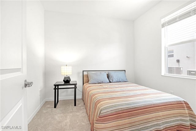 carpeted bedroom with baseboards