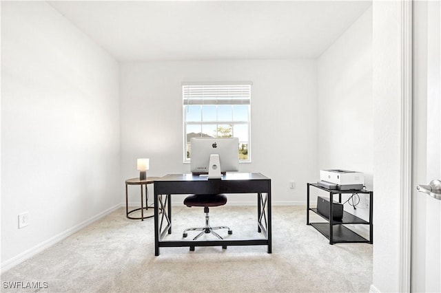 home office with carpet floors and baseboards