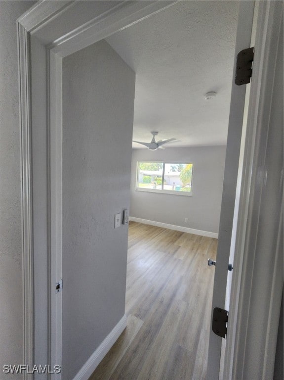 corridor featuring light hardwood / wood-style floors