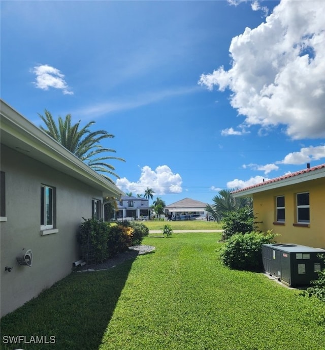 view of yard with central AC unit