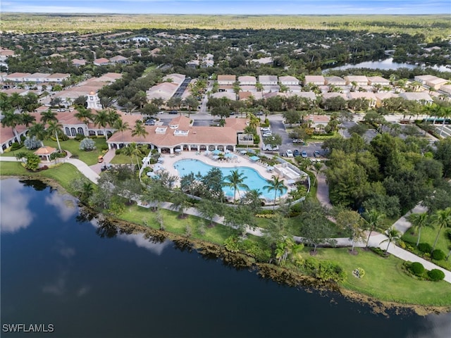 birds eye view of property with a water view