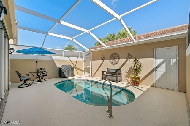 view of swimming pool featuring grilling area, glass enclosure, and a patio