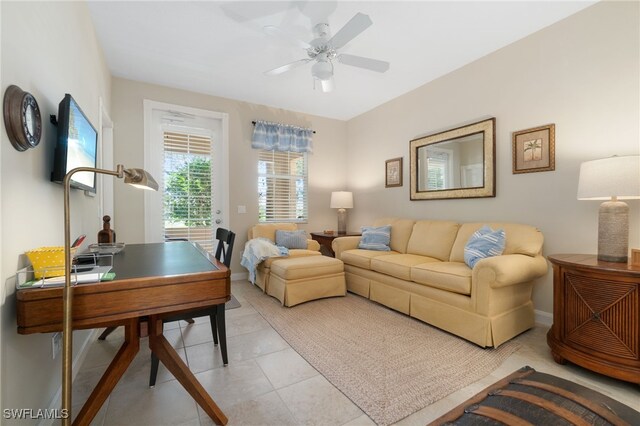 living room featuring ceiling fan and light tile patterned floors