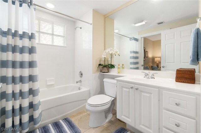 full bathroom with tile patterned floors, vanity, toilet, and shower / tub combo with curtain