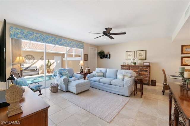 tiled living room with ceiling fan