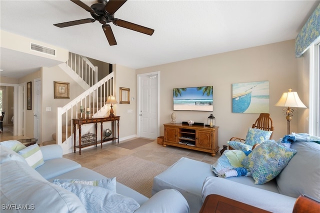 tiled living room featuring ceiling fan