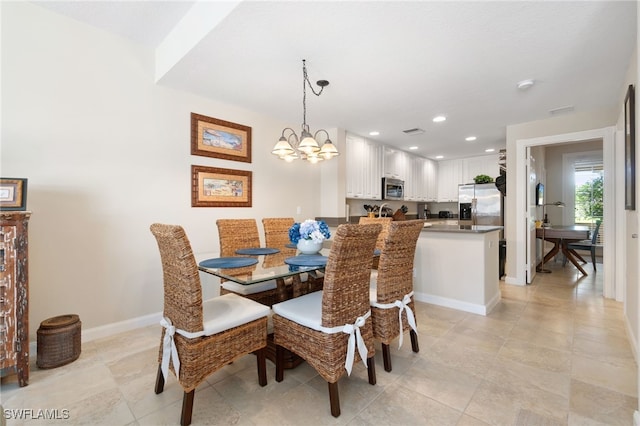 dining space with a chandelier