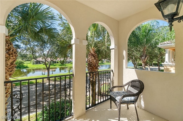 balcony featuring a water view