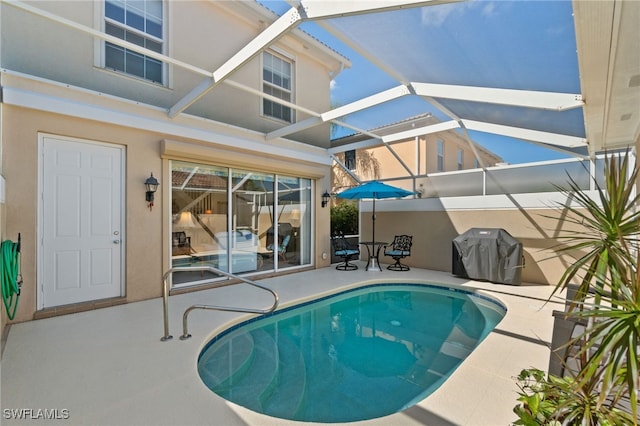 view of swimming pool with a lanai, area for grilling, and a patio area