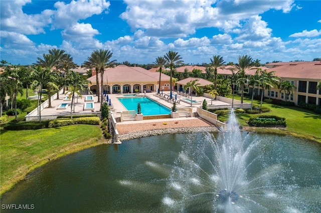 571 Avellino Isles Cir Unit 27102, Naples, FL 34119 - swimming pool featuring a patio, a yard, and a water view