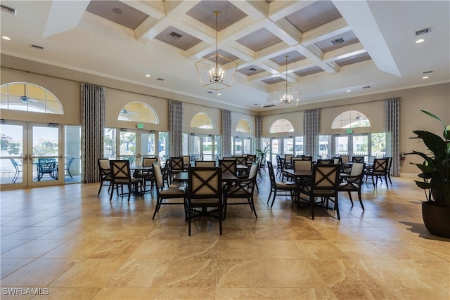 571 Avellino Isles Cir Unit 27102, Naples, FL 34119 - dining area with french doors, a towering ceiling, coffered ceiling, ornamental molding, and a chandelier