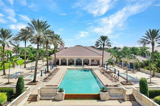 571 Avellino Isles Cir Unit 27102, Naples, FL 34119 - community pool featuring a patio