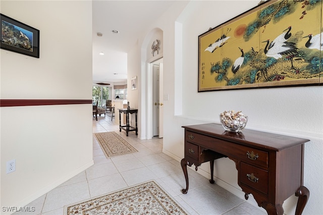 corridor featuring light tile patterned flooring