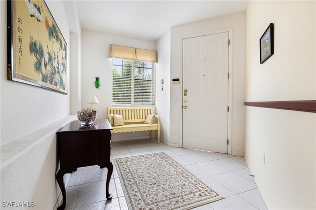 entryway featuring light tile patterned floors