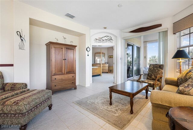 living room with light tile patterned flooring