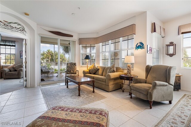 living room with light tile patterned floors and a healthy amount of sunlight