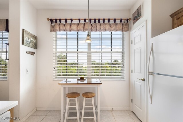 dining room featuring light tile patterned flooring