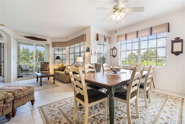 tiled dining space with ceiling fan