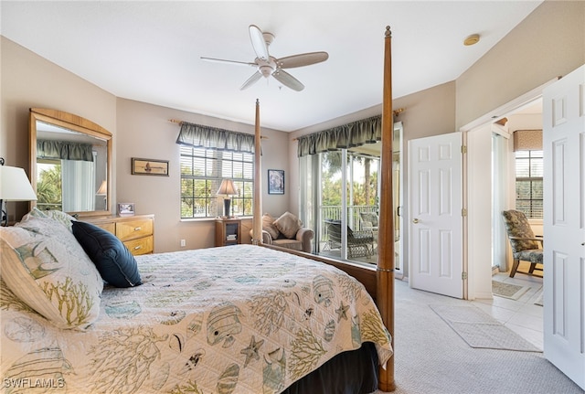 bedroom with ceiling fan, light carpet, and access to outside