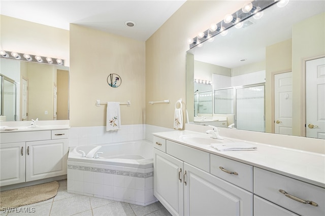 bathroom with tile patterned flooring, vanity, and independent shower and bath