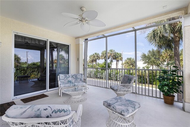 sunroom featuring ceiling fan