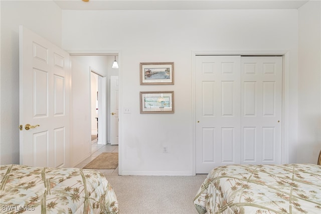 carpeted bedroom featuring a closet