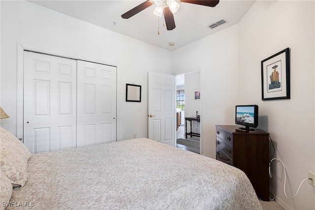 bedroom featuring carpet flooring, ceiling fan, and a closet