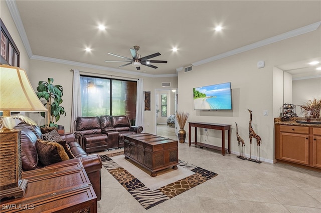 tiled living room featuring ceiling fan, sink, and ornamental molding